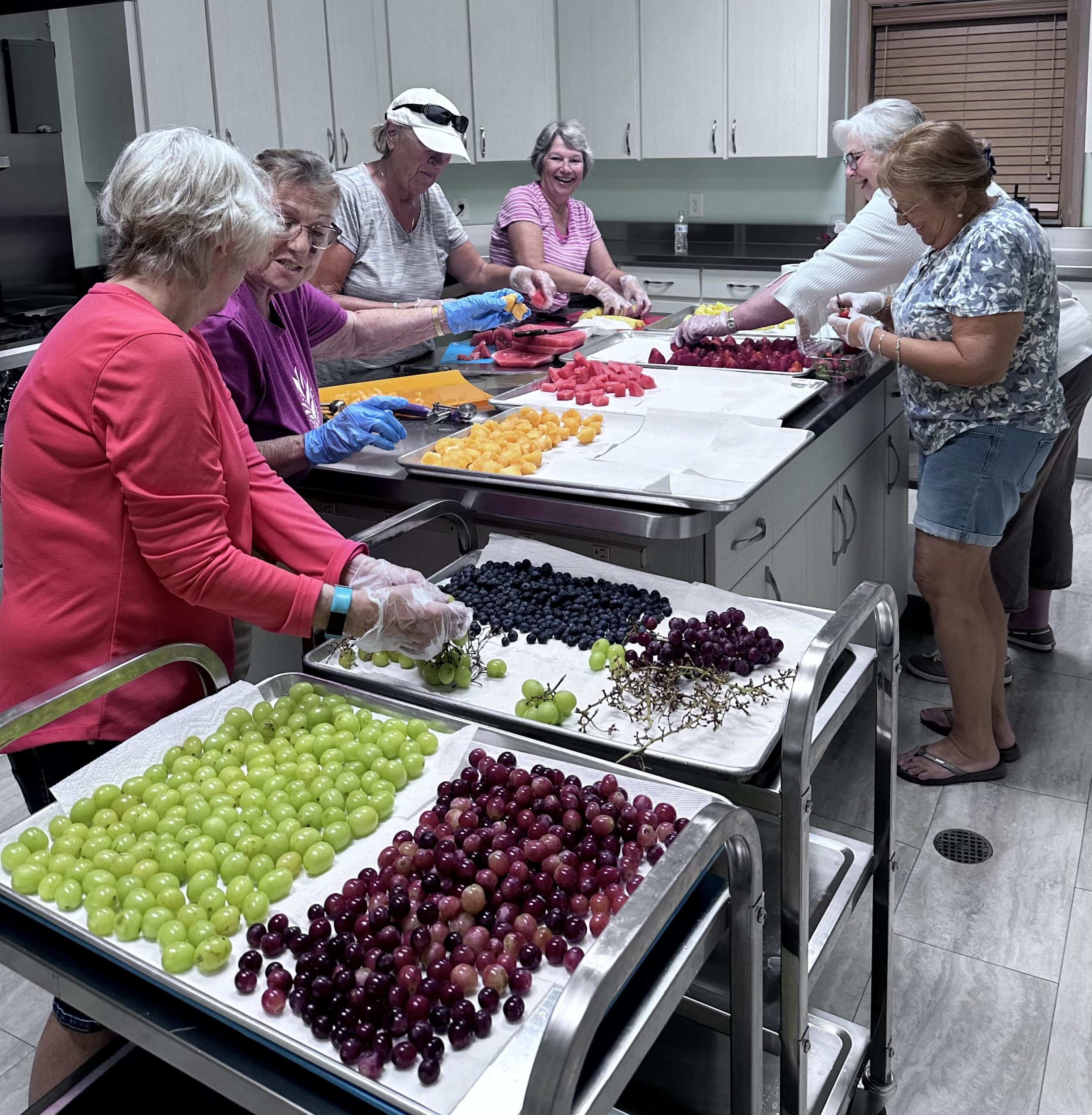 kitchen helpers cutting fruit